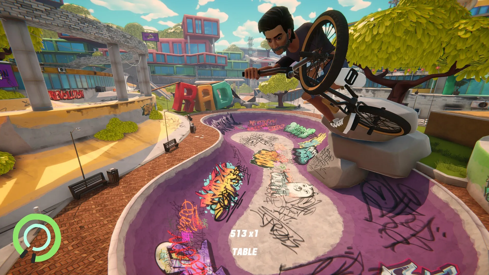 Streetdog BMX: Rider performs a table trick above a colorful, graffiti-filled skatepark bowl.