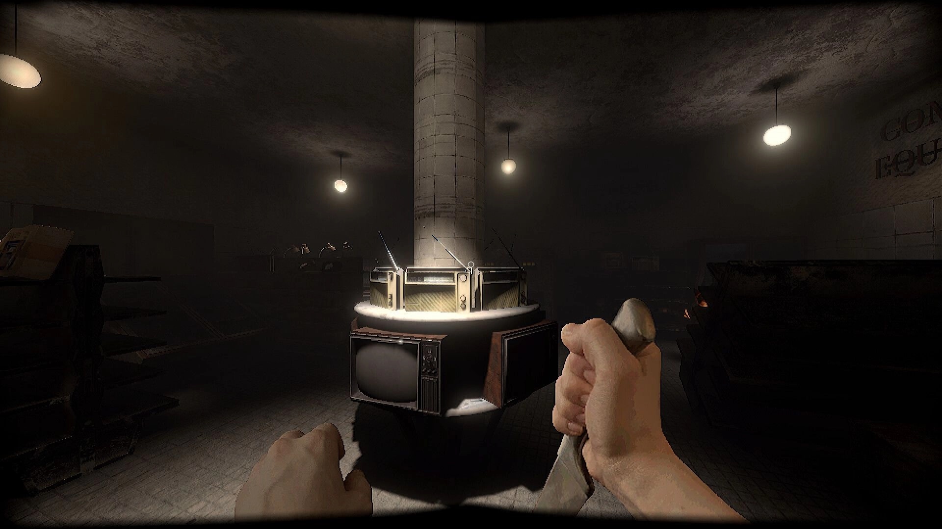 Subjectivation: First-person view holding a metal tool near a lit pillar with old TVs in dark room.