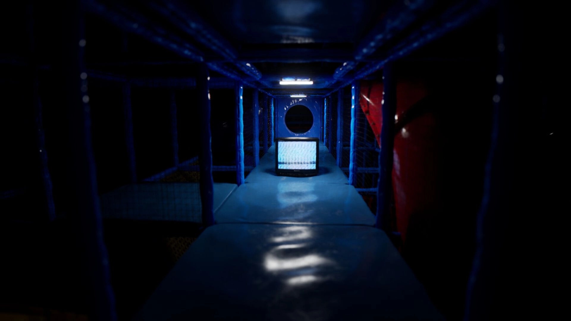 Subliminal: Dark, eerie tunnel with a glowing screen and a circular opening in a dimly lit environment.