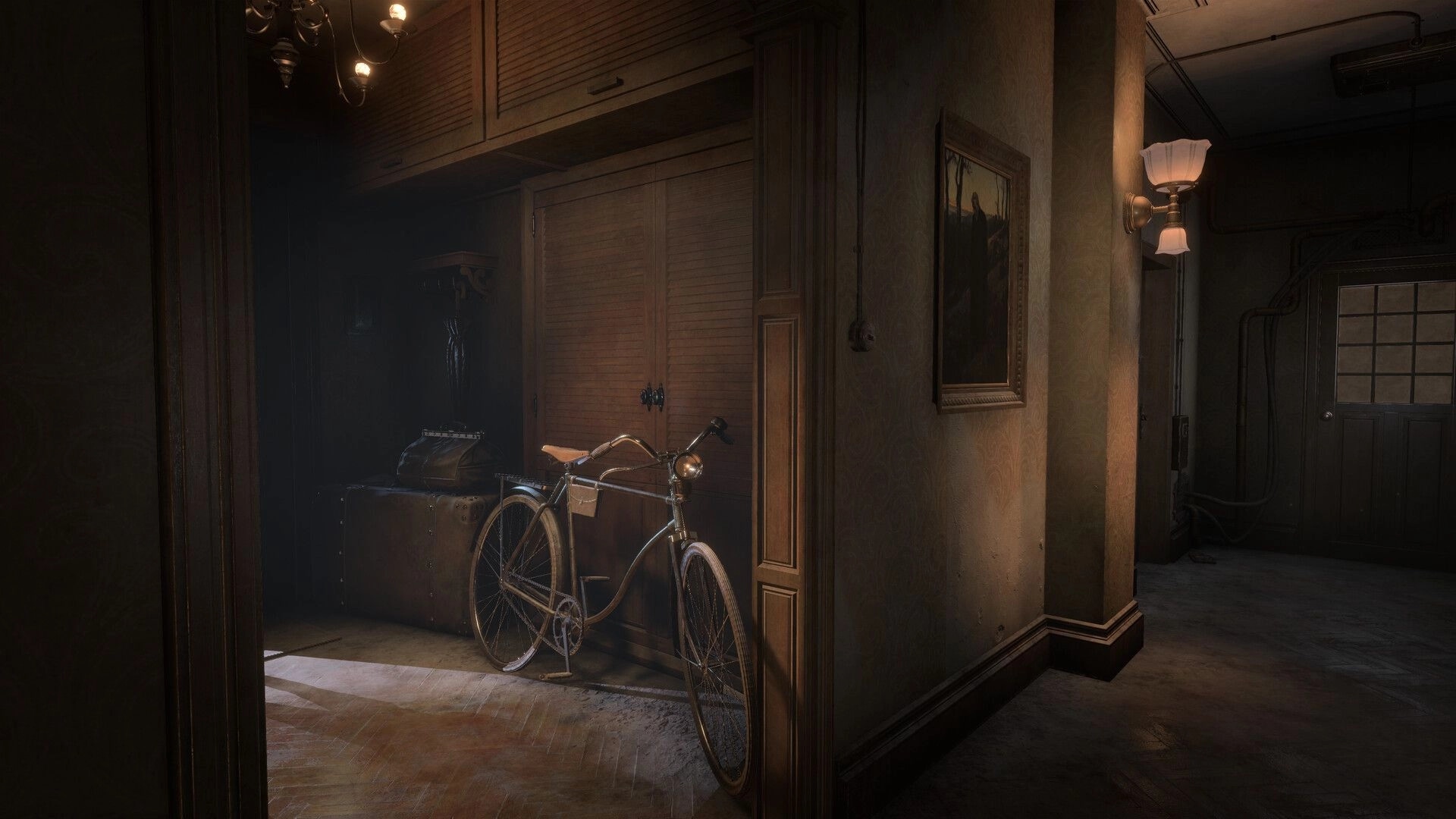Sublustrum: Bicycle leaning by old suitcases in a dim hallway with wall lamp and framed painting.