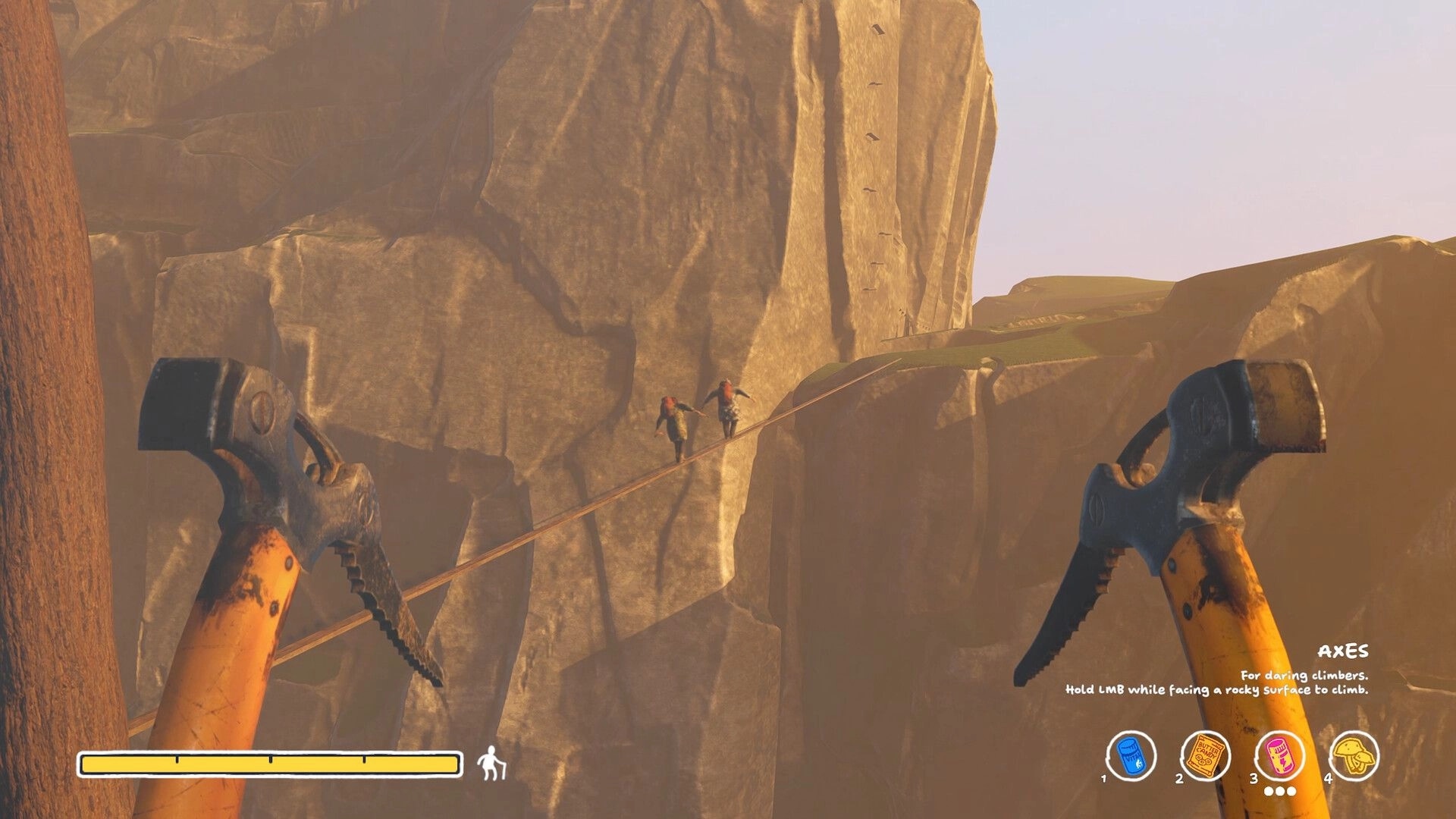 Sunset Summit: First-person axes view as two climbers cross a rope bridge between rocky cliffs at dusk.