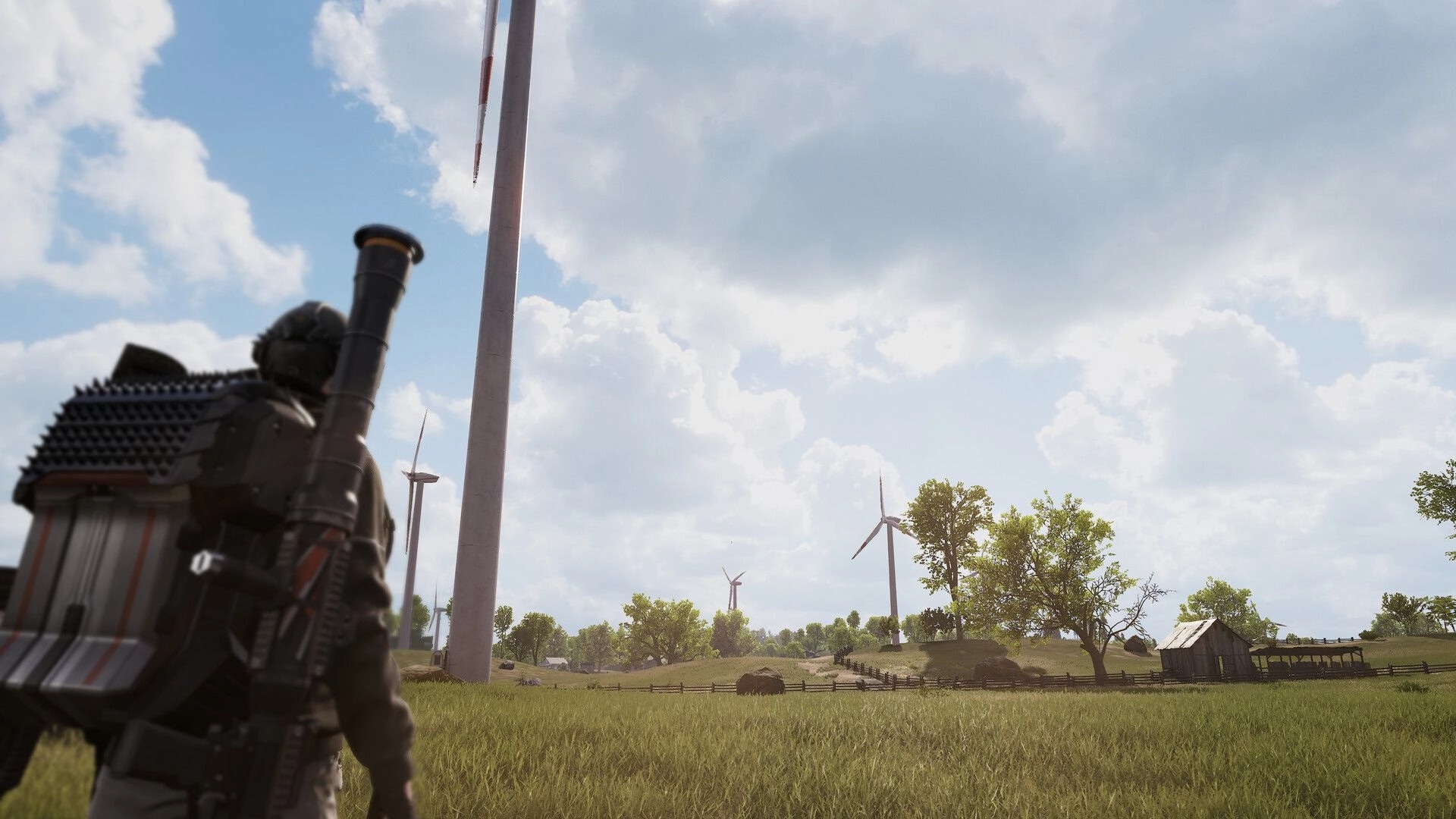 SUPER PEOPLE: Character with rocket launcher in grassy field, wind turbines and barn in the distance