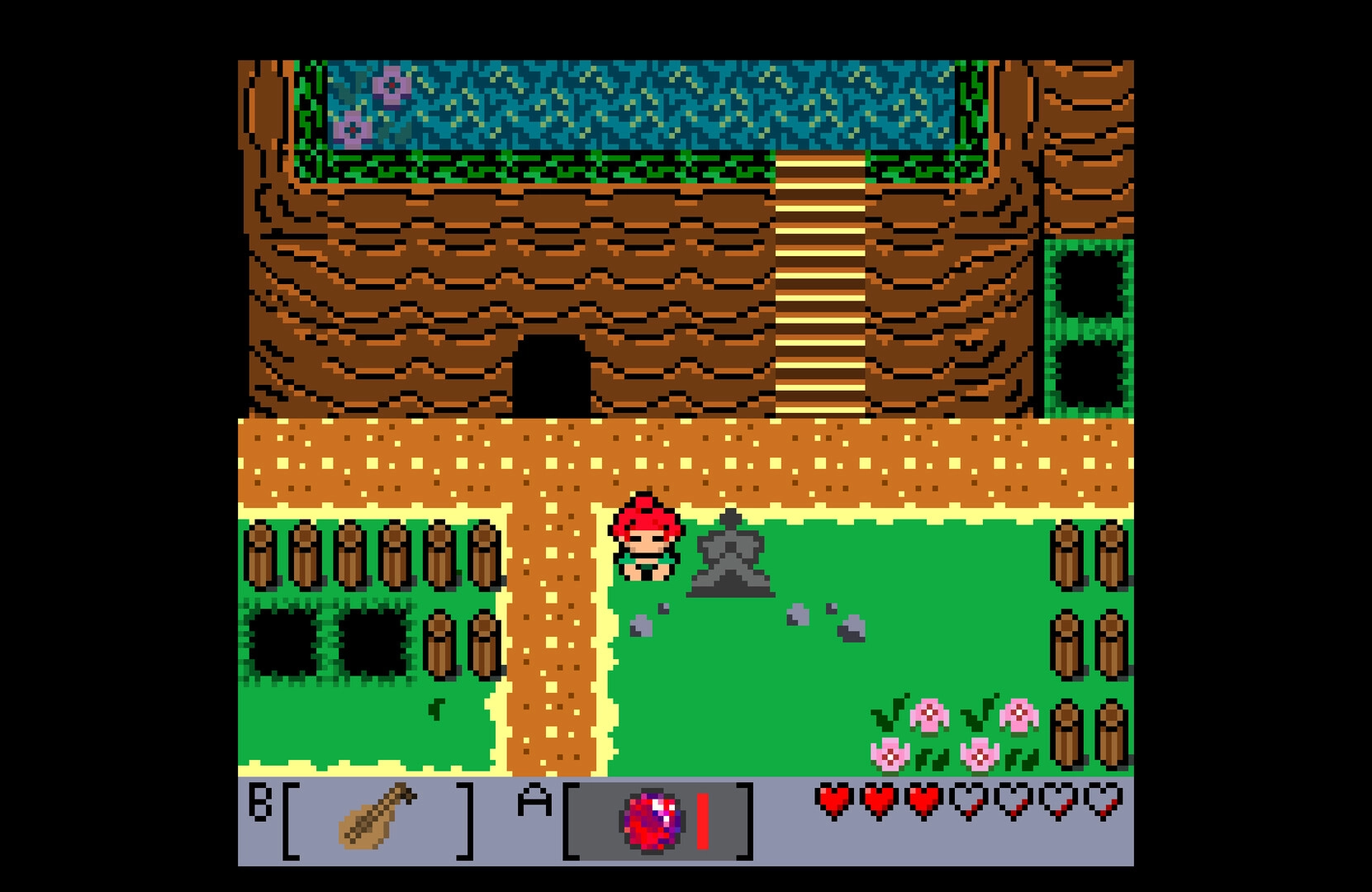 Tashio Tempo: Hero stands by a stone marker near cliff stairs, hearts and B/A item bar below.
