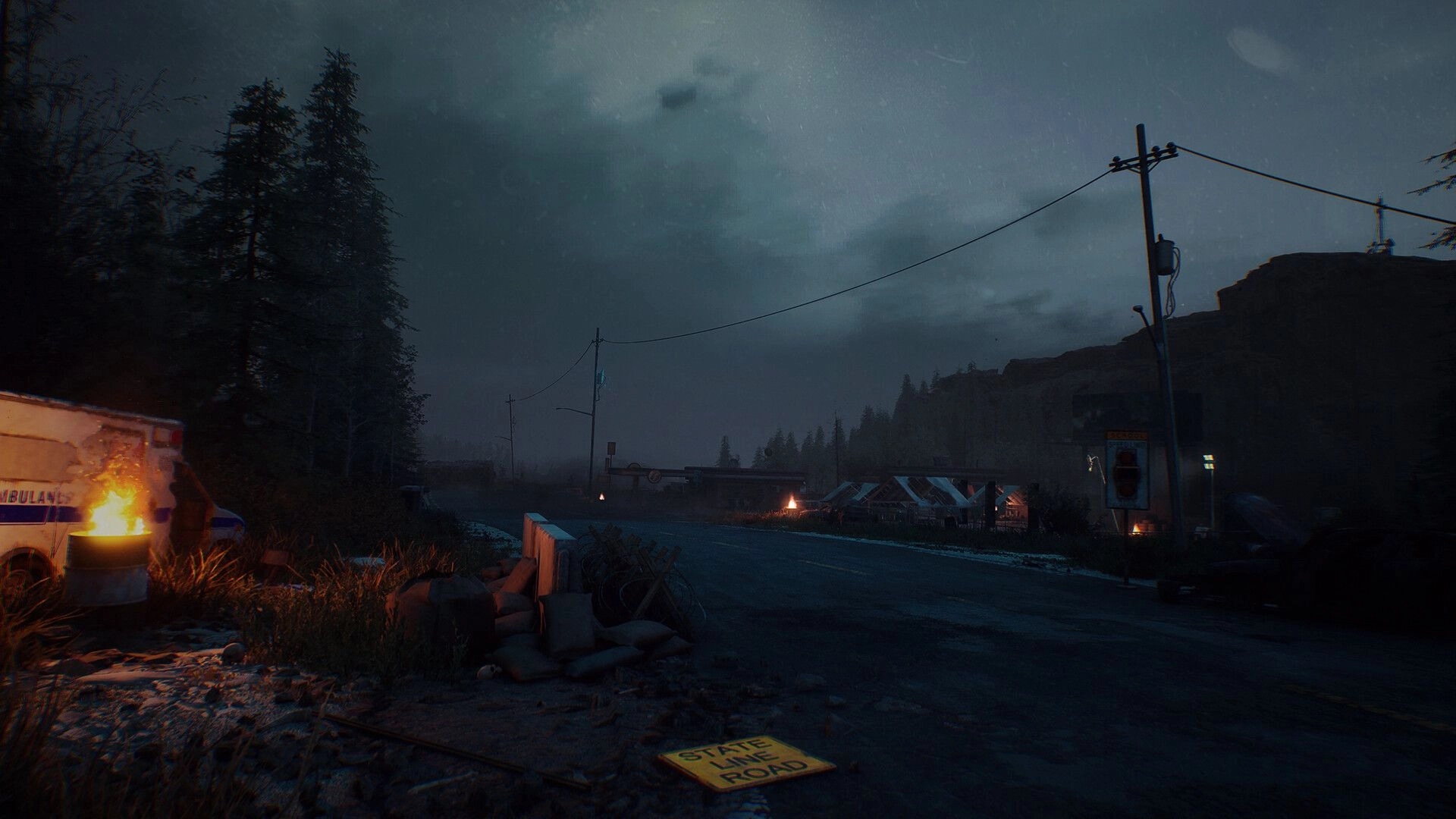 Terminator: Abandoned highway checkpoint with barricades and fires under stormy night sky in rain.