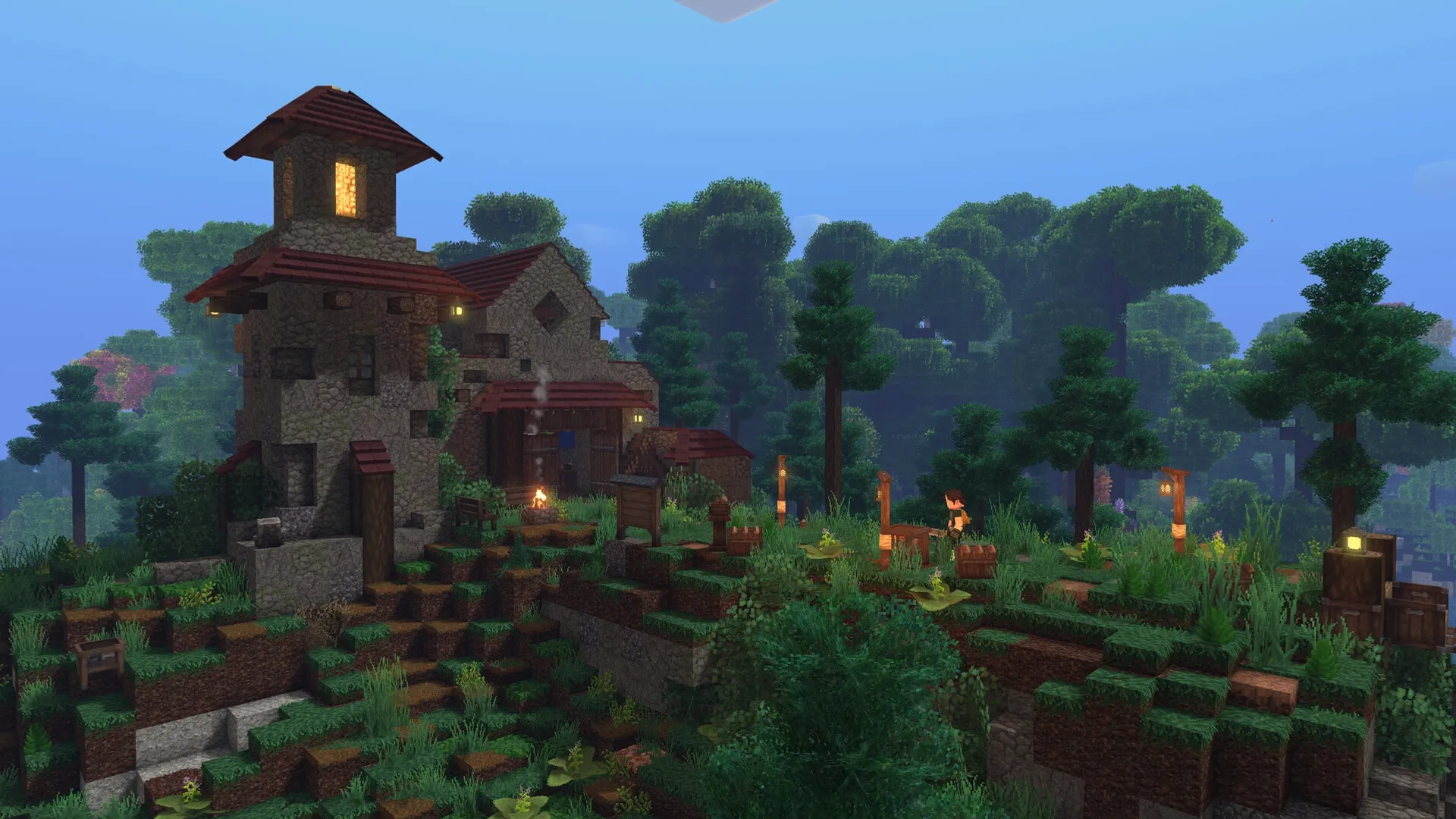 Tesera: Player near stone house with lit torches on a grassy hill in a lush forest environment