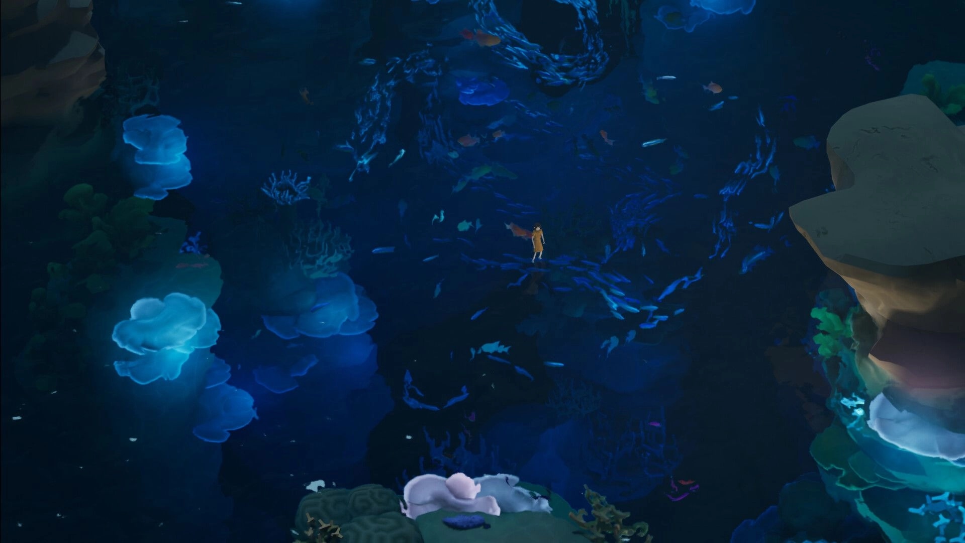 The Edge of Water: Girl stands amid swirling blue fish currents in a dark underwater reef cavern.