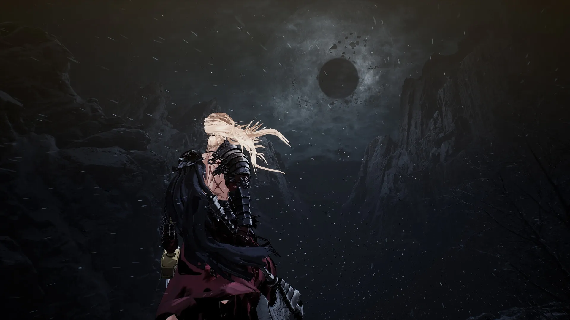 The First Berserker: Khazan stands under a dark, ominous eclipse in a rugged, snow-covered mountain pass.