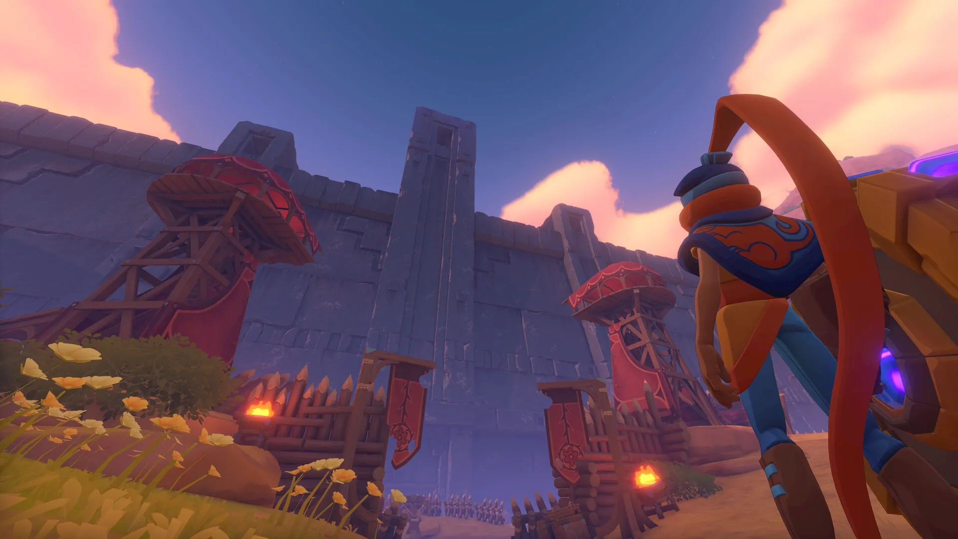 The Knightling: Player character stands before a fortified gate with watchtowers in a sunset-lit valley.