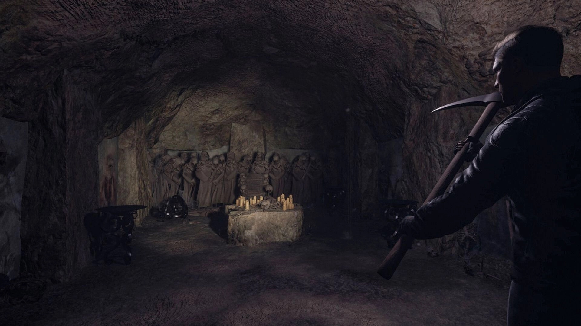 The Midnighters: Player with pickaxe explores eerie cave altar surrounded by statues and candles