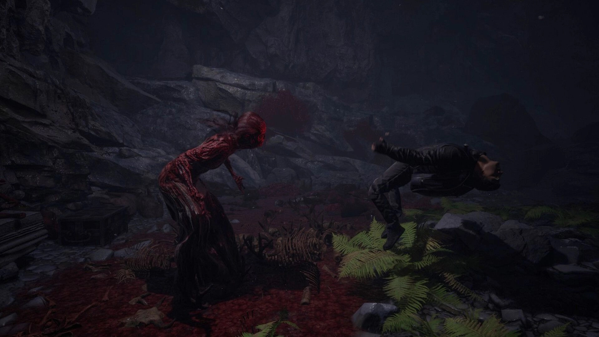 The Midnighters: Creature attacks player in a dark cave scattered with bones and eerie red light