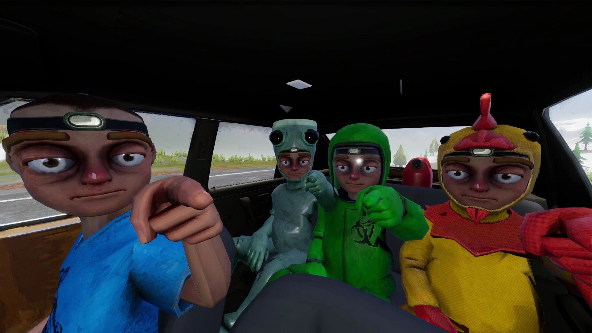 The Road: Four co-op players in quirky helmets pose inside a car, road and trees visible outside.