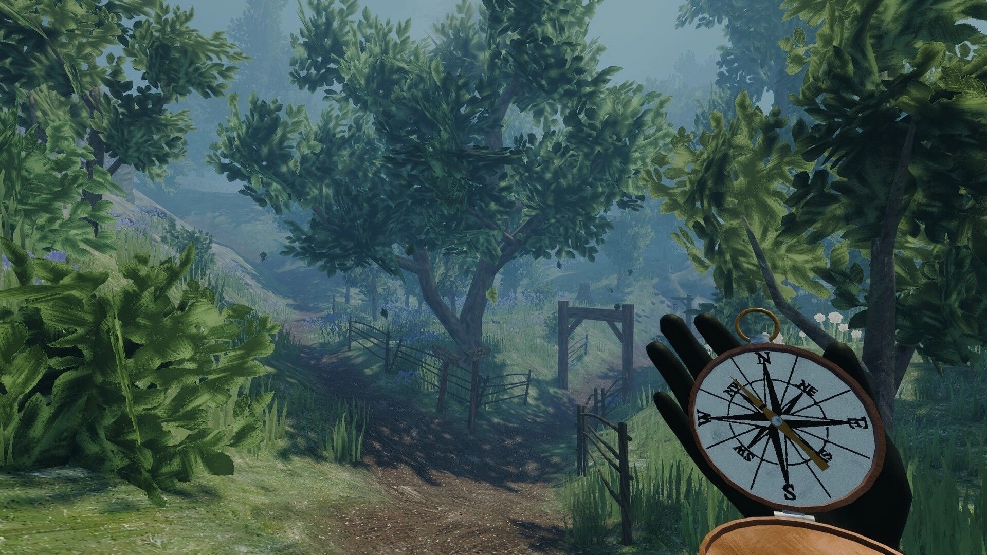 The UNDA Legacy: First-person view holding a compass on a misty forest path with fences and trees.