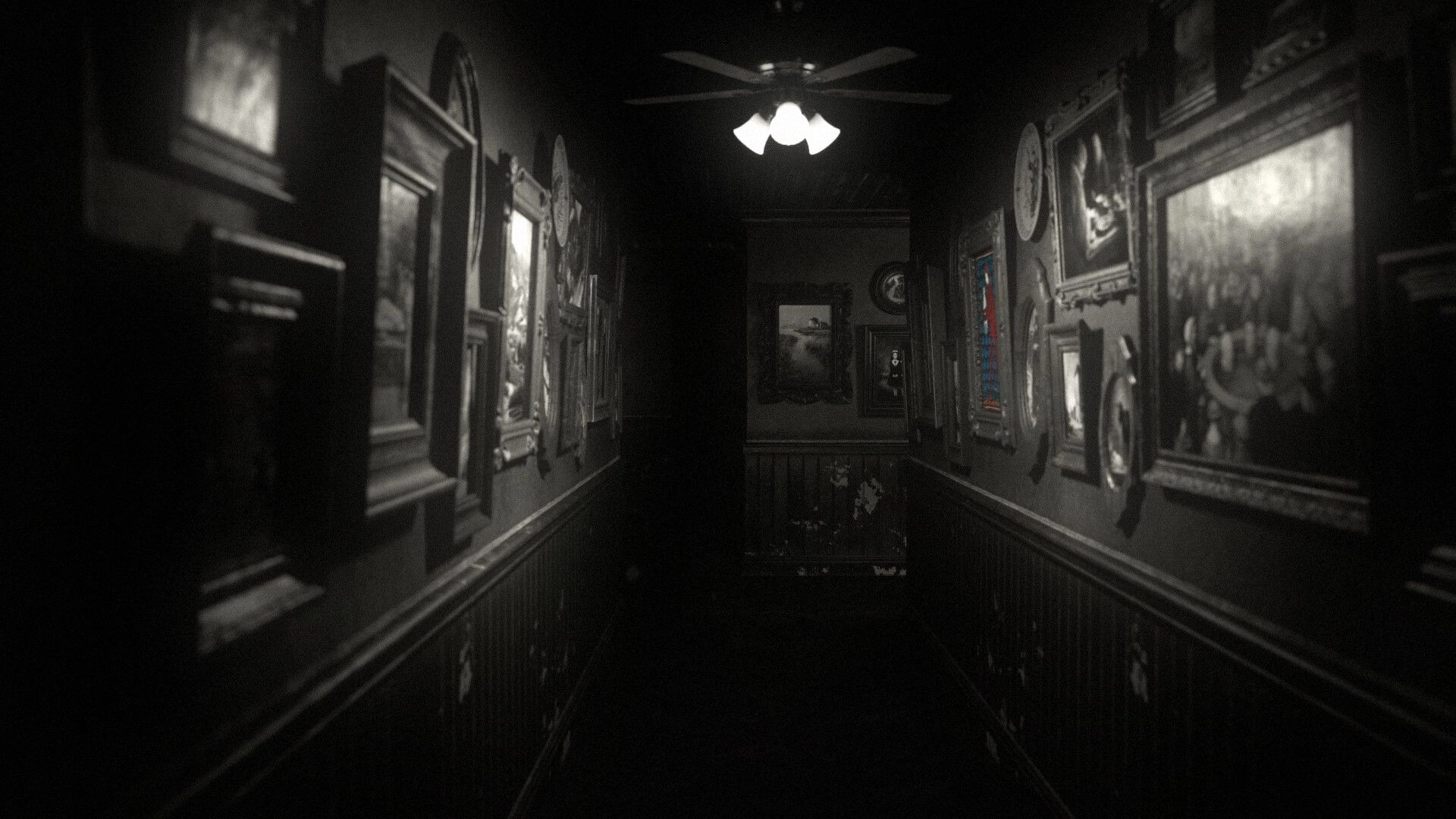 The Unworthy: First-person view down a dark hallway lined with framed portraits and a ceiling fan light.