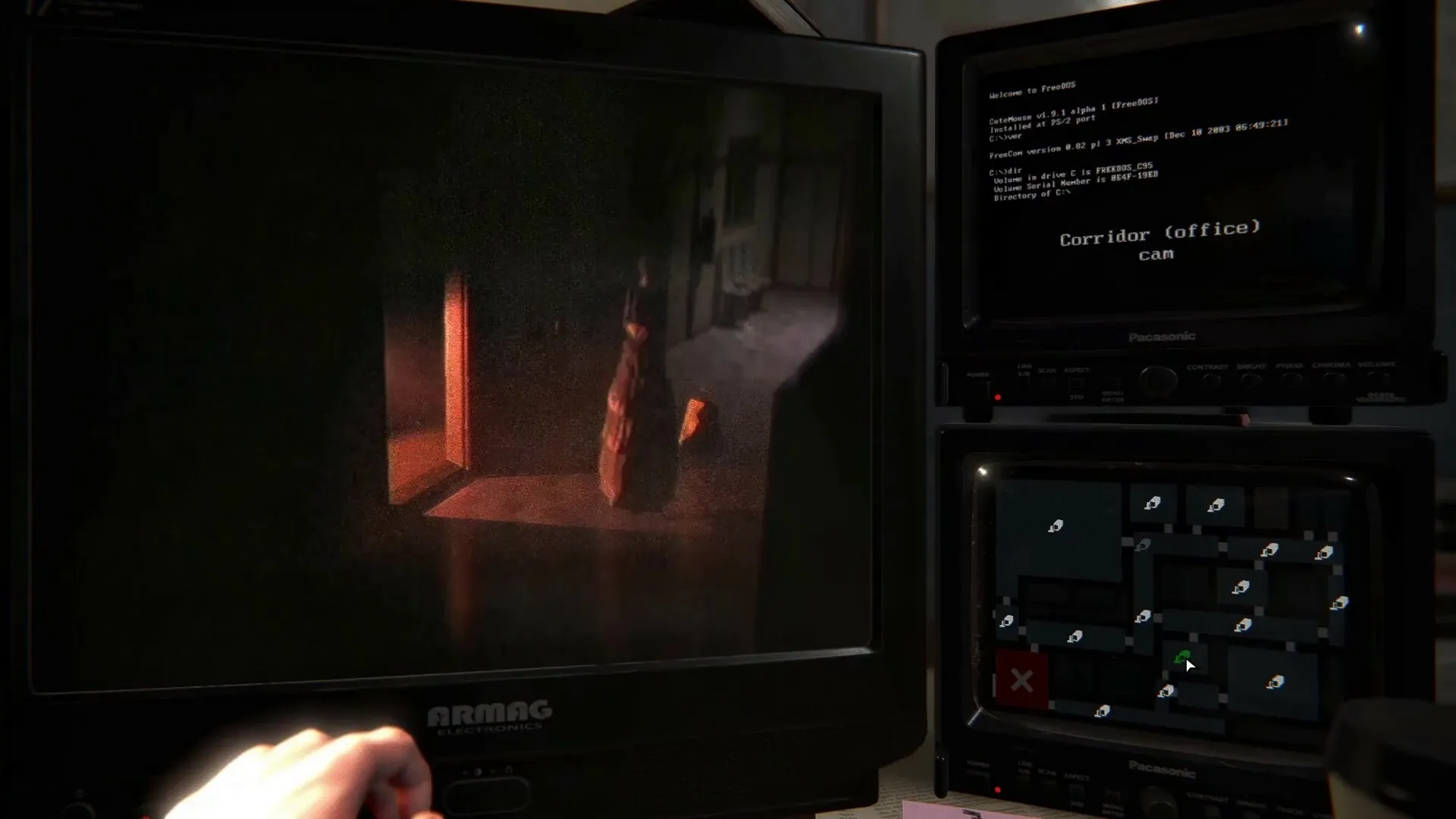 TIC-TAC: Monitor shows dark corridor with eerie figure; multiple security camera feeds in control room.