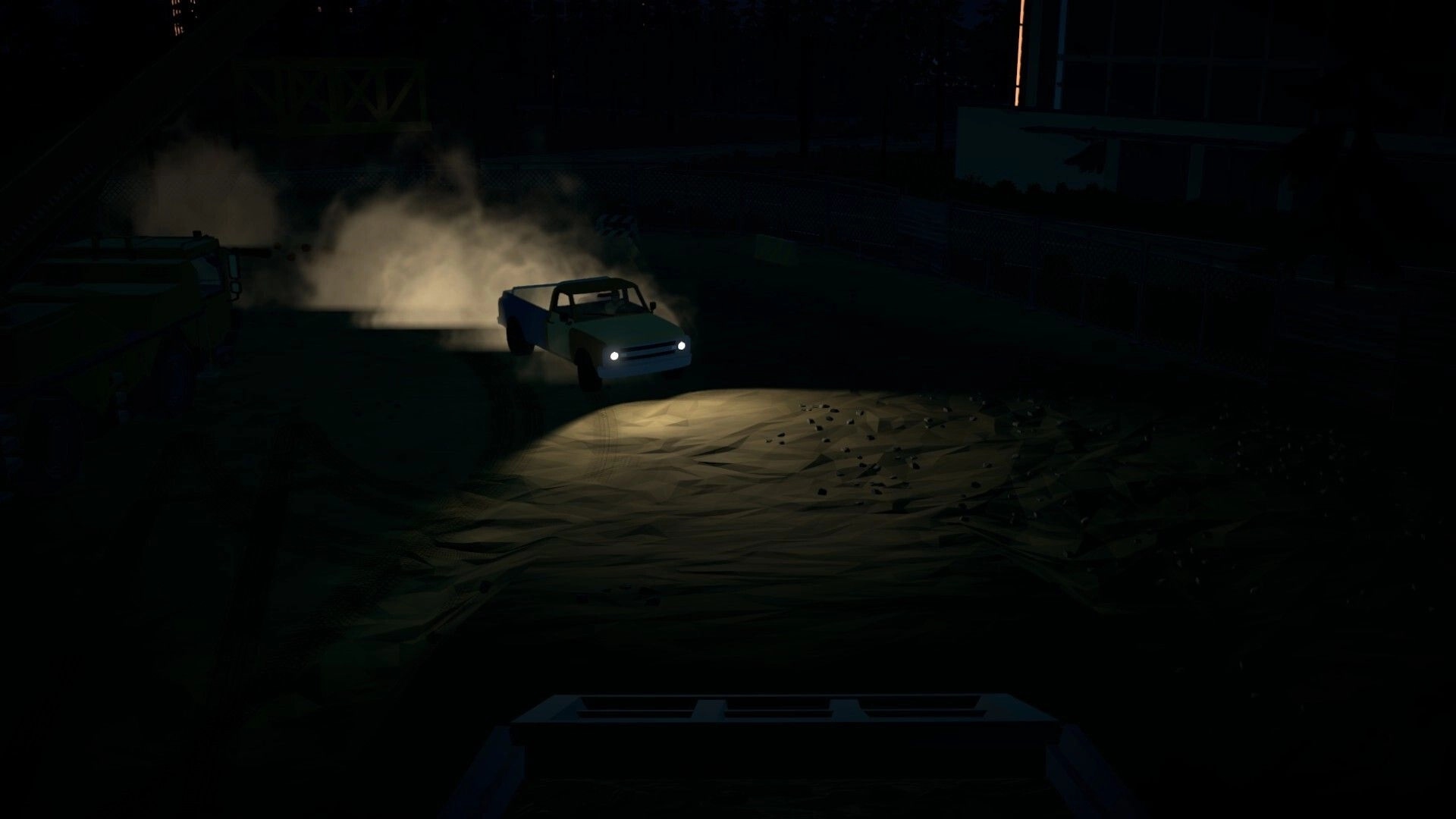 Tie Down: Pickup truck with headlights on skids through dust at night in an industrial yard.