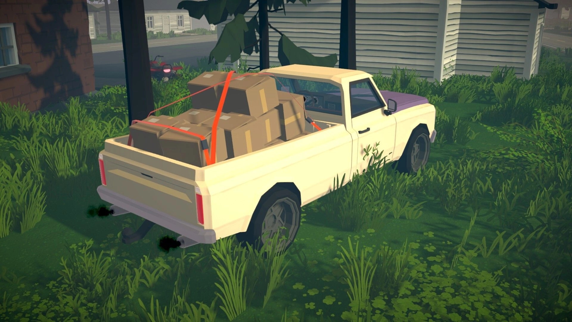 Tie Down: Pickup truck loaded with strapped boxes parked in grassy yard beside a house.