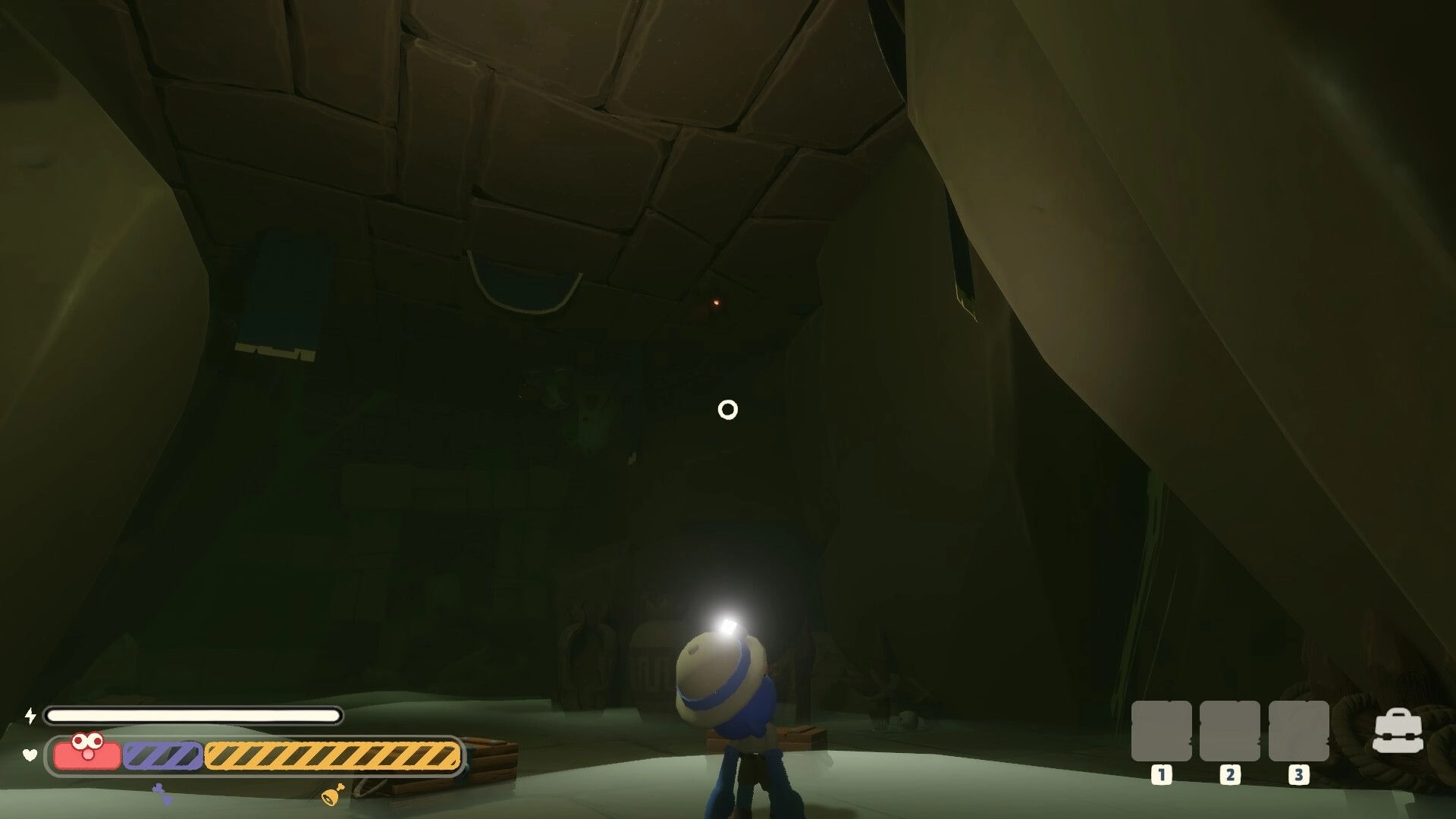 Too Deep To Quit: Explorer with headlamp aims reticle in dim stone chamber with stamina and item slots UI.