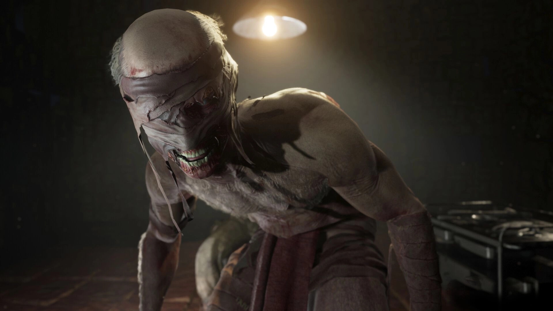 TORMENTOR: Menacing creature lurks in a dimly lit room with surgical tools on a metal table nearby