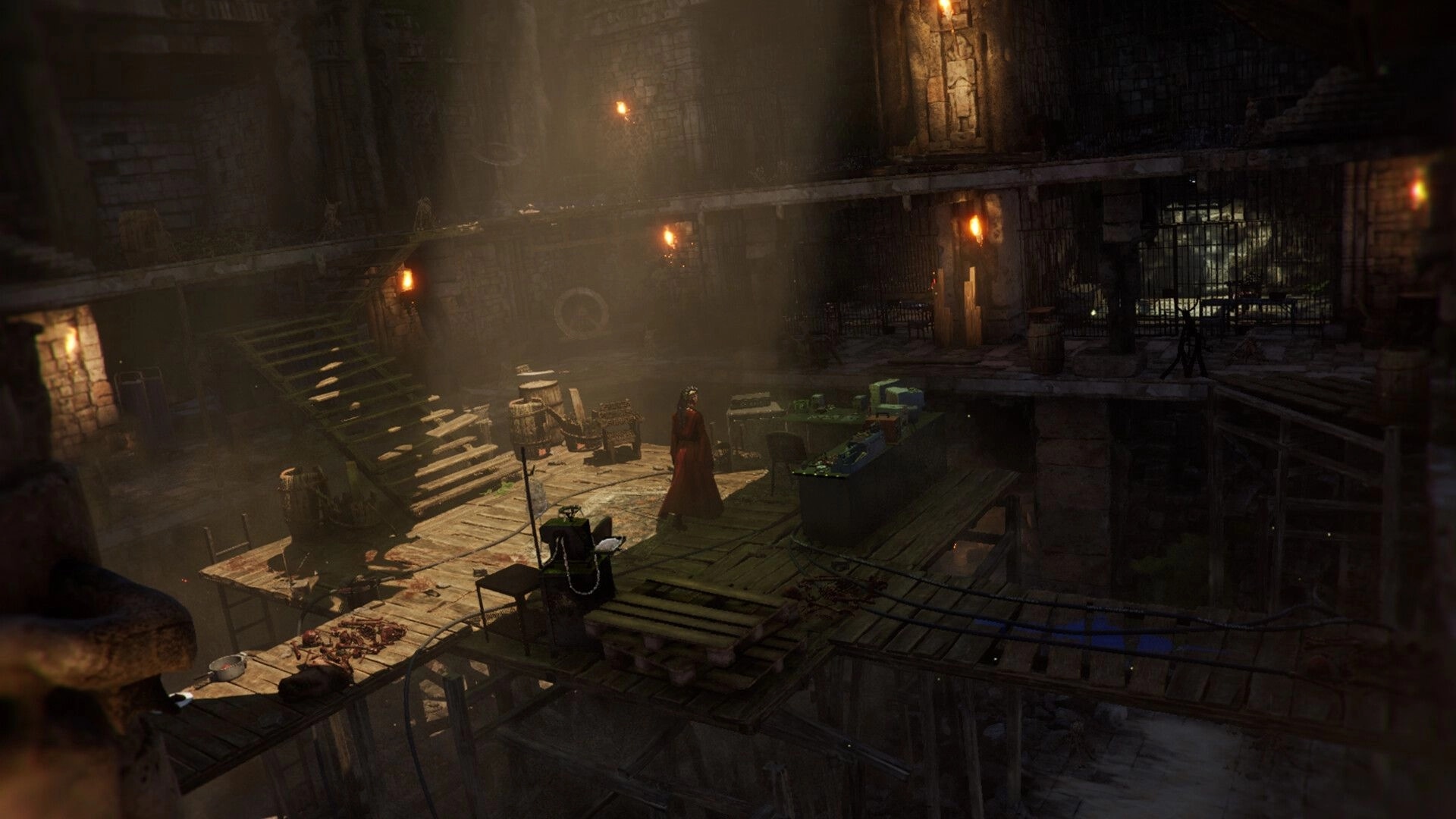 TORMENTOR: Lone figure in dungeon-like lair, surrounded by equipment and dimly lit by torches.