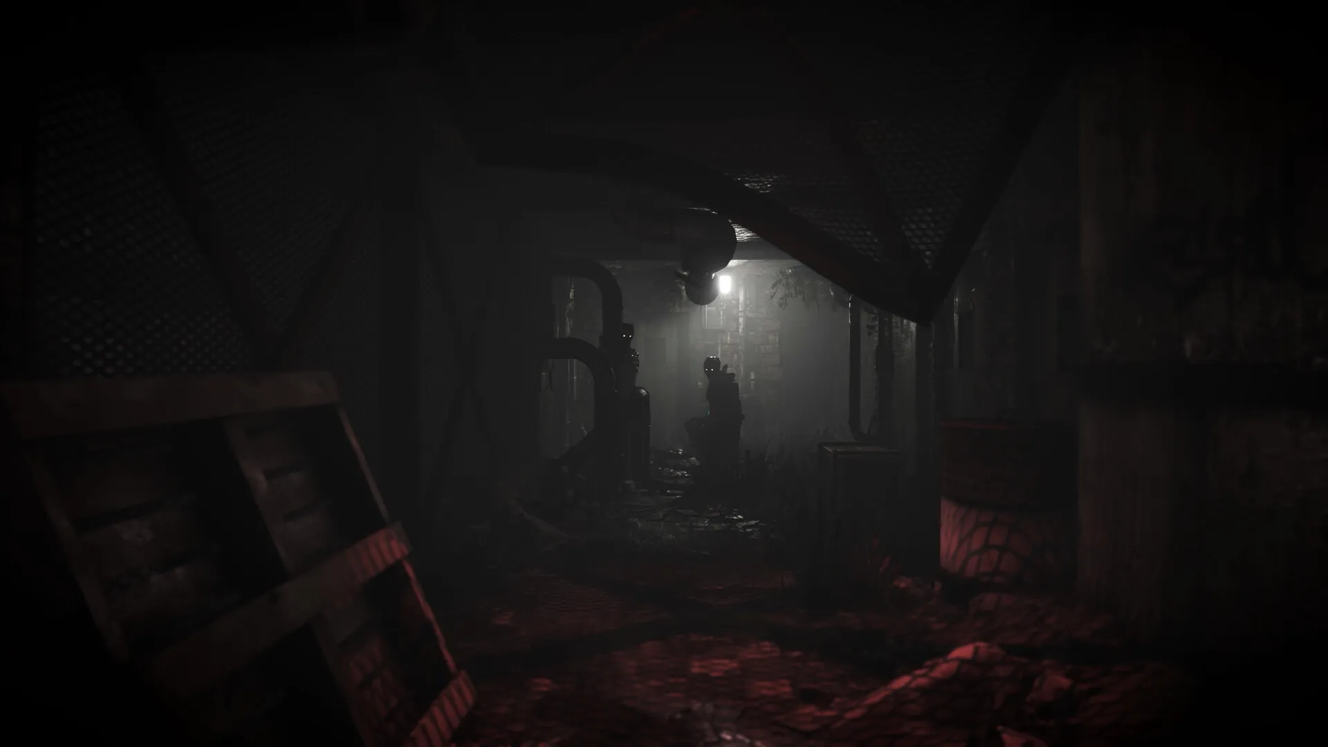 Total Chaos: Dimly lit corridor with silhouetted figure and pipes in a decaying industrial setting
