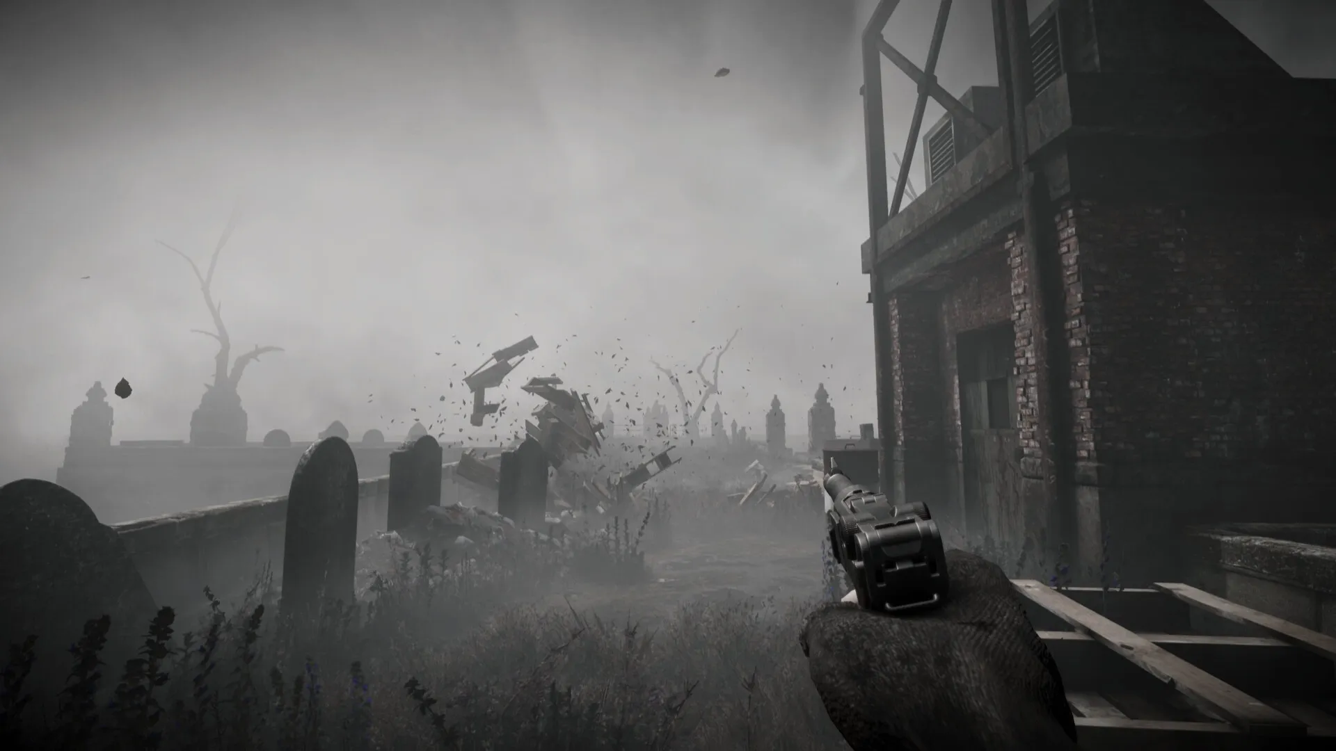 Total Chaos: Player aims pistol at debris flying in foggy graveyard near abandoned brick building