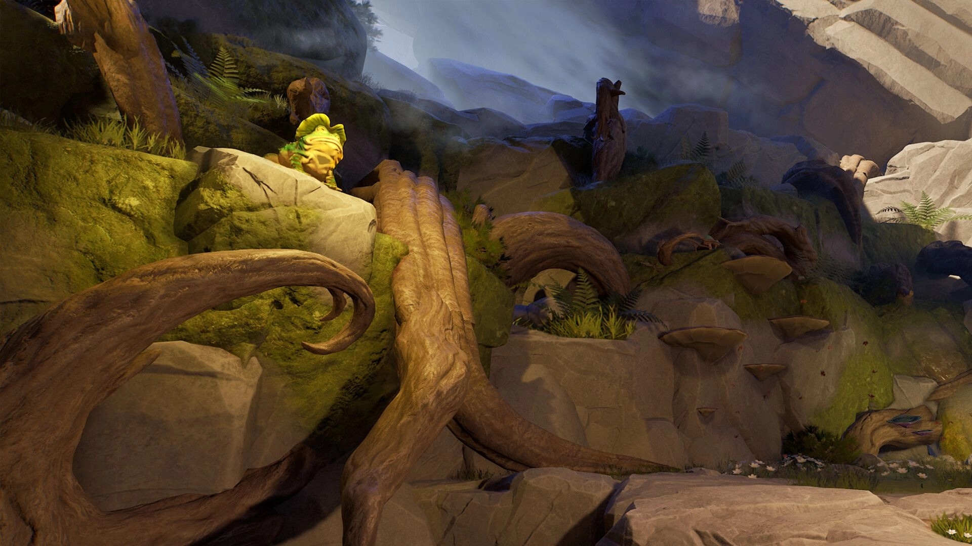 Toto’s Journey: Small green creature perched on mossy rocks amid twisted roots and foggy cliffs.