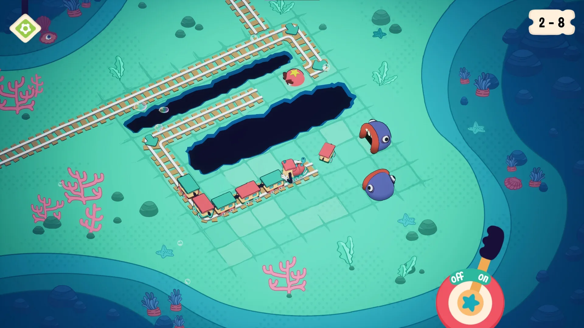 Trackastrophe!: Train navigates winding tracks with colorful carriages and obstacles in underwater world.