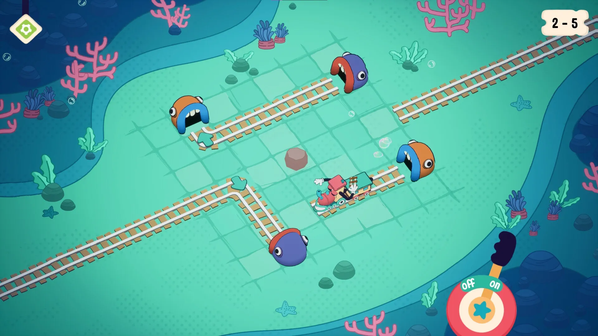 Trackastrophe!: Train navigates underwater tracks past colorful sea creatures and corals with UI overlay.