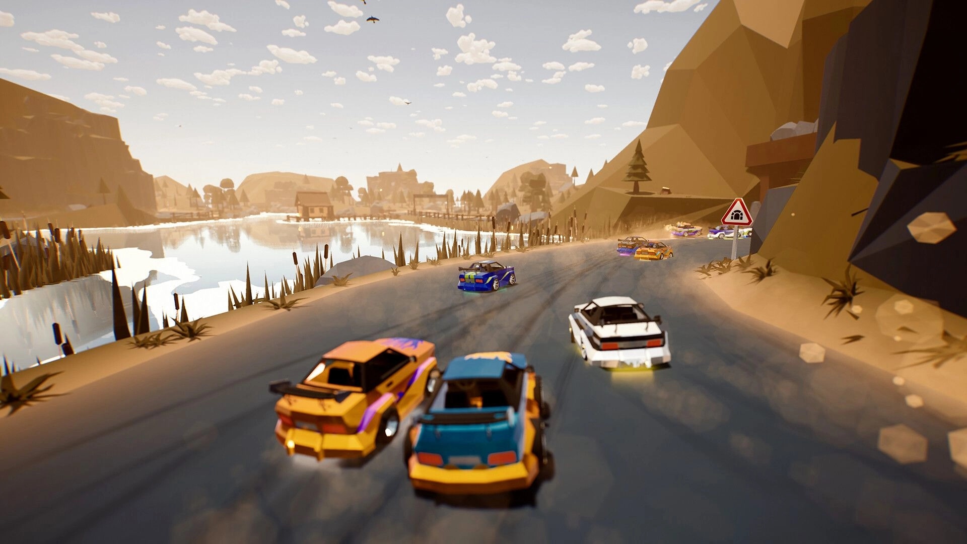 Traks: Pack of colorful cars drifting on a lakeside road beside low-poly mountains and town.