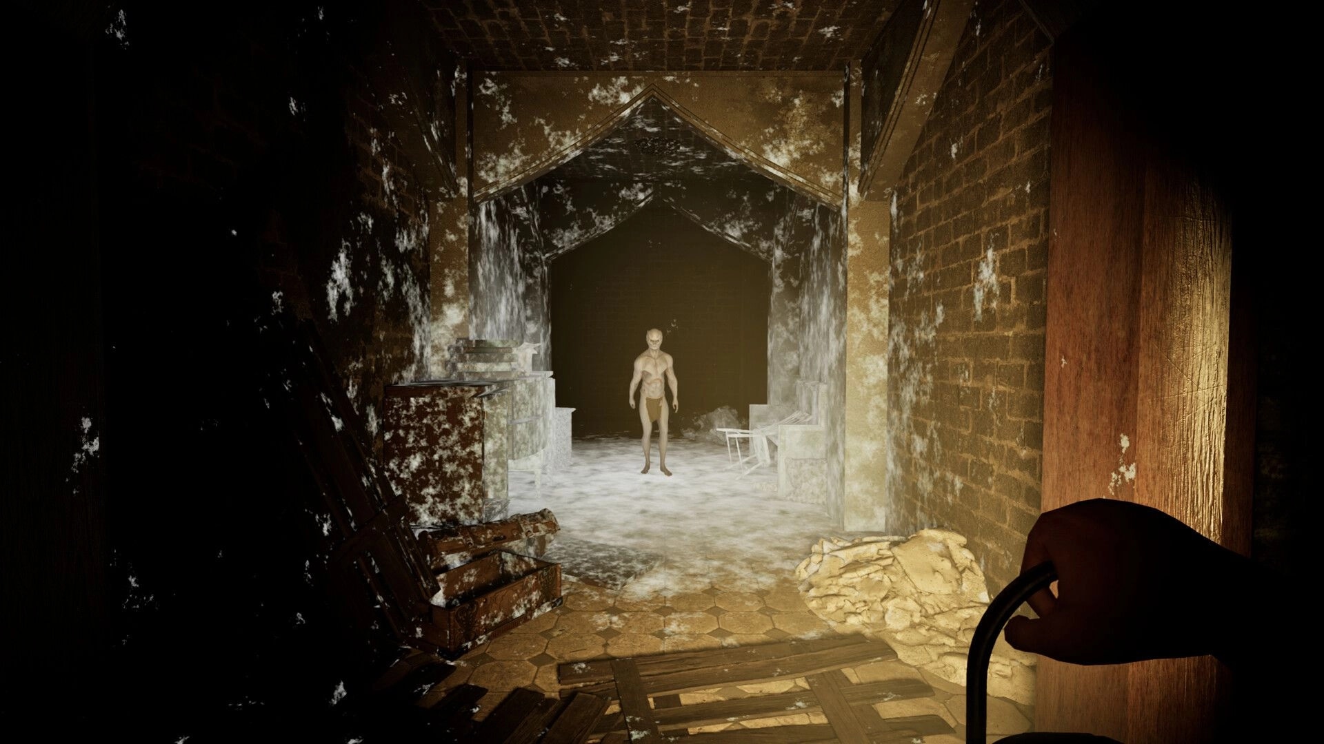 Triangle: Player holds lantern, confronting a demonic figure in a decaying, dimly lit village hallway.