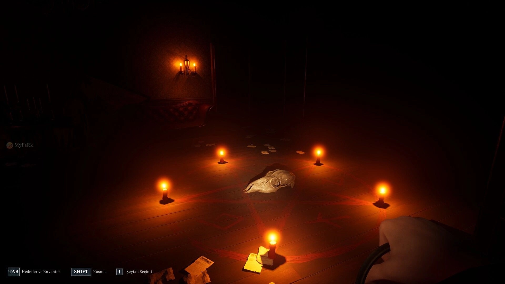 Triangle: Ritual circle lit by candles on wooden floor in dimly lit room with skull centerpiece