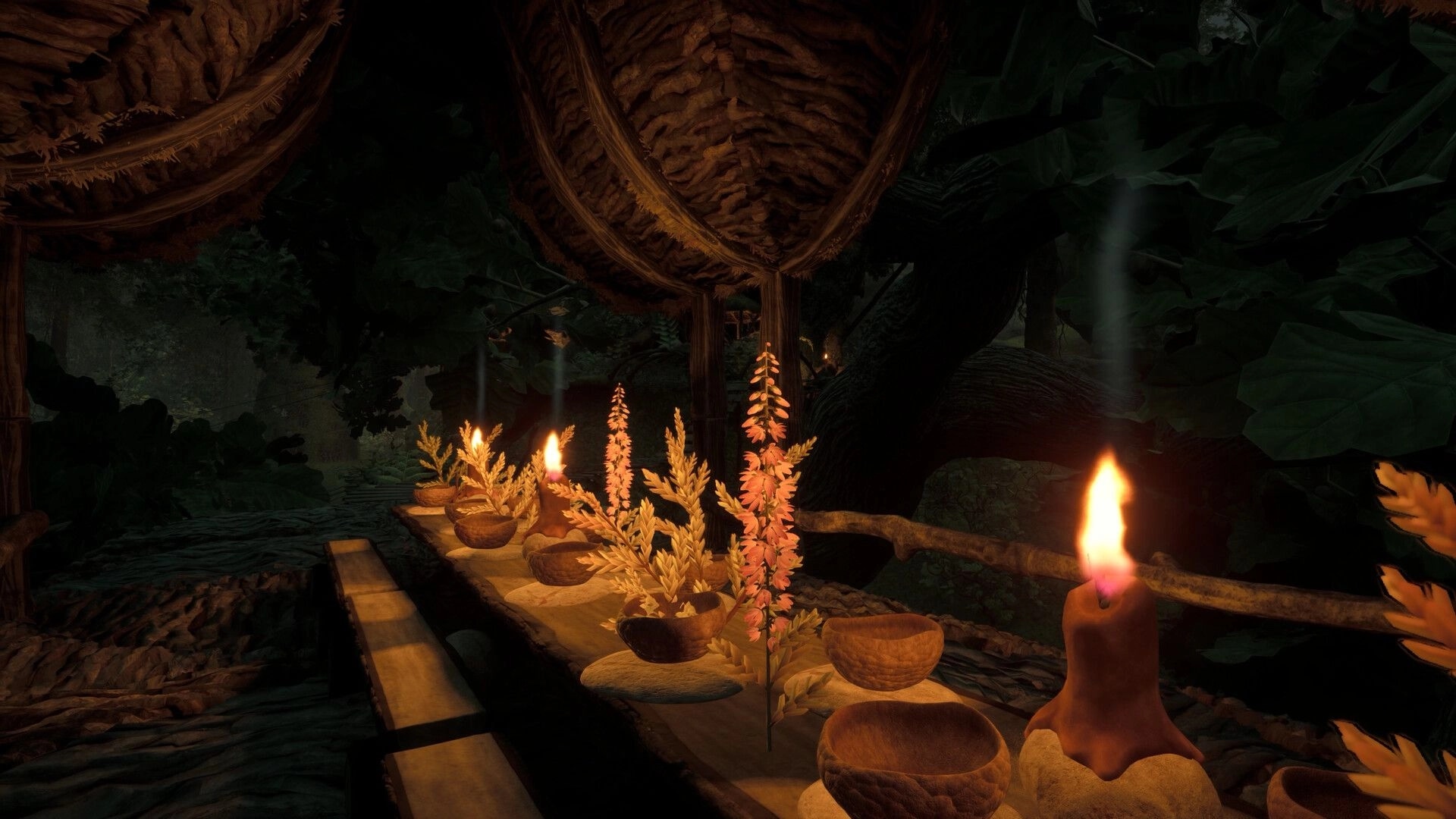 TROLLHEIM: Candlelit table with wooden bowls and flowers on a treetop platform in dark forest canopy.