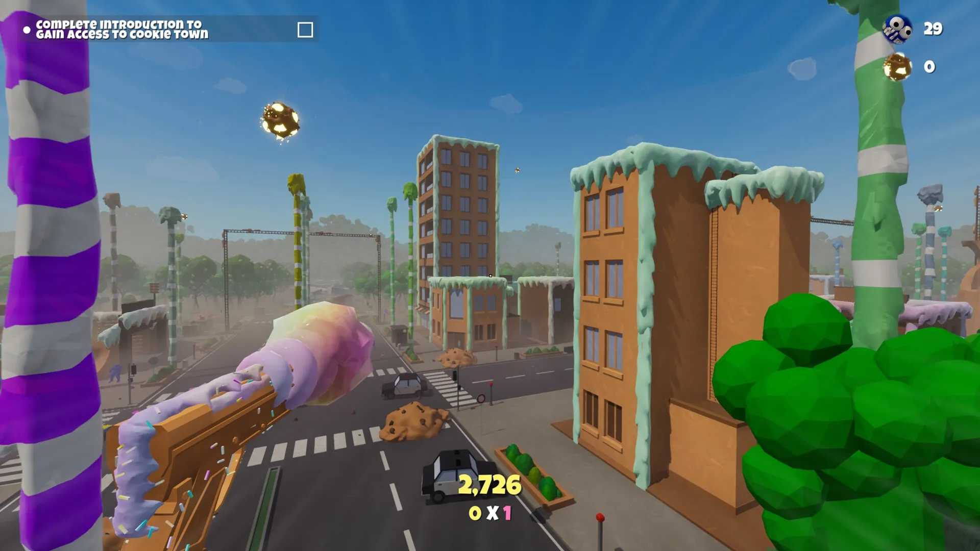 Trouble in Cookie Town: First-person view of cookie-themed buildings and candy weapon in sweet cityscape