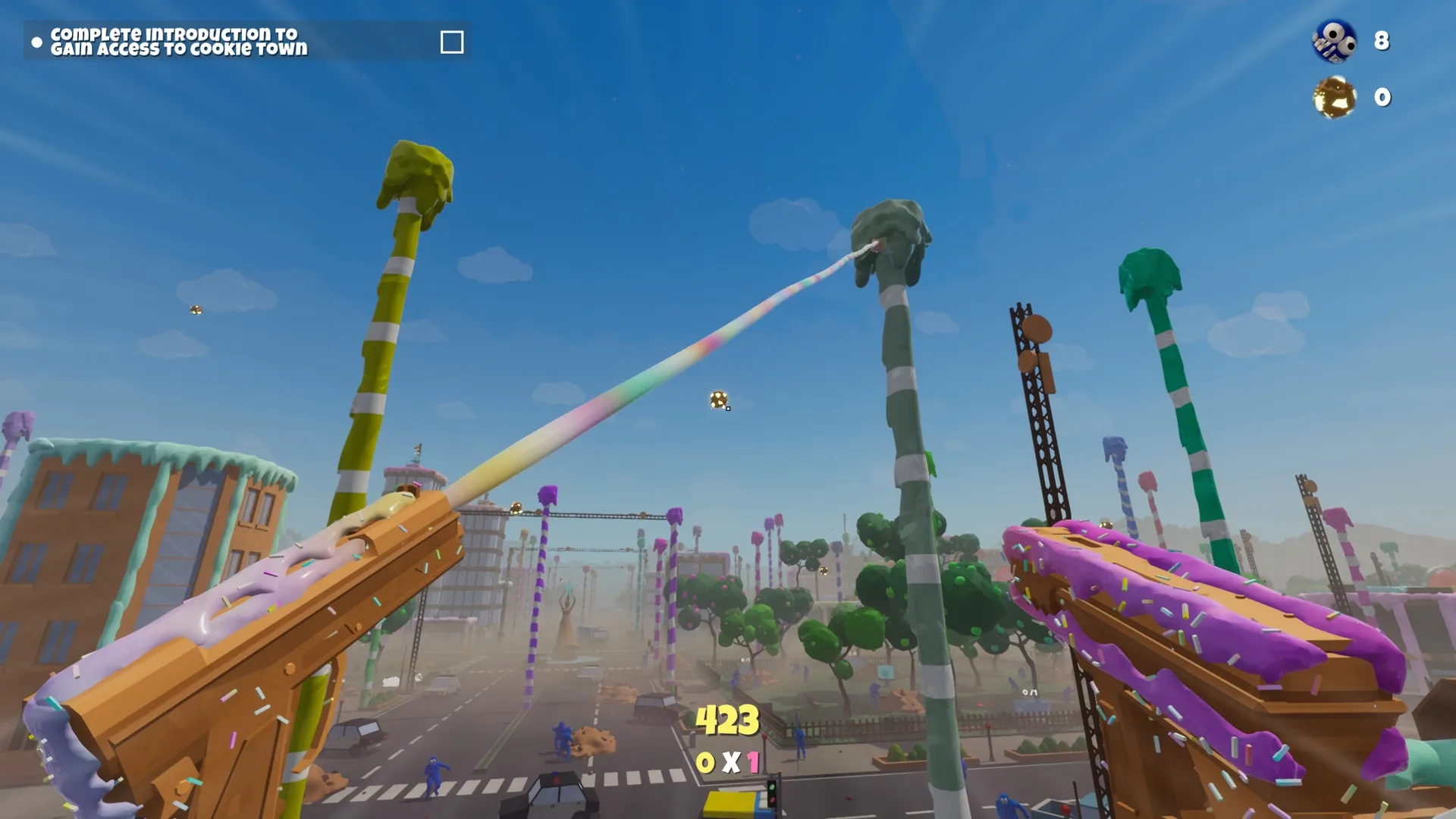 Trouble in Cookie Town: Dual rainbow cannons aim at green candy trees in colorful cityscape.