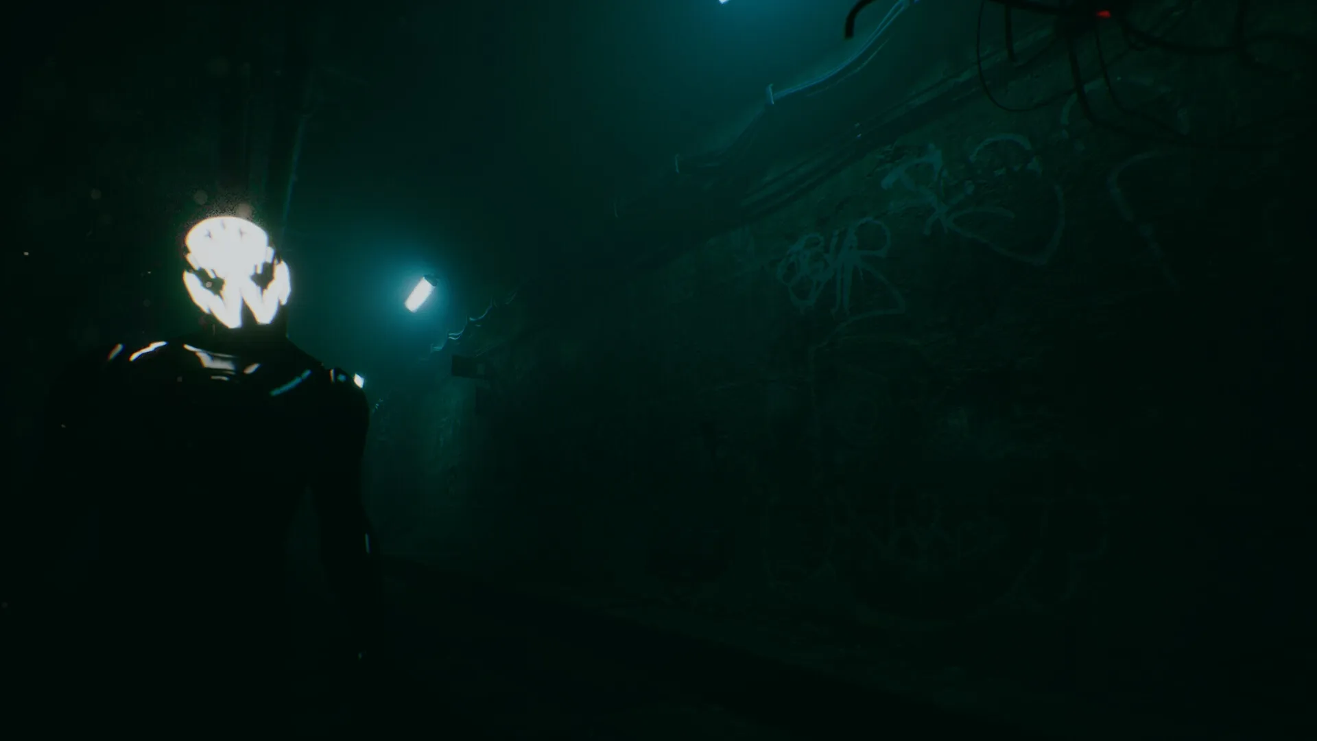 Turnout: Eerie figure with glowing face in dark subway tunnel with graffiti-covered walls