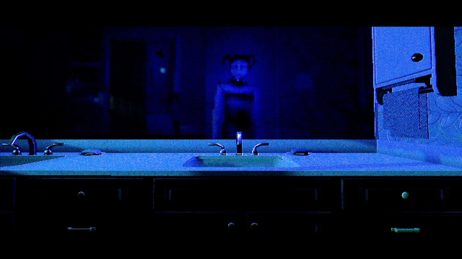 T.W.I.R.L.: Blue-lit bathroom sink and counter with mirror reflection and open cabinet drawer at night.