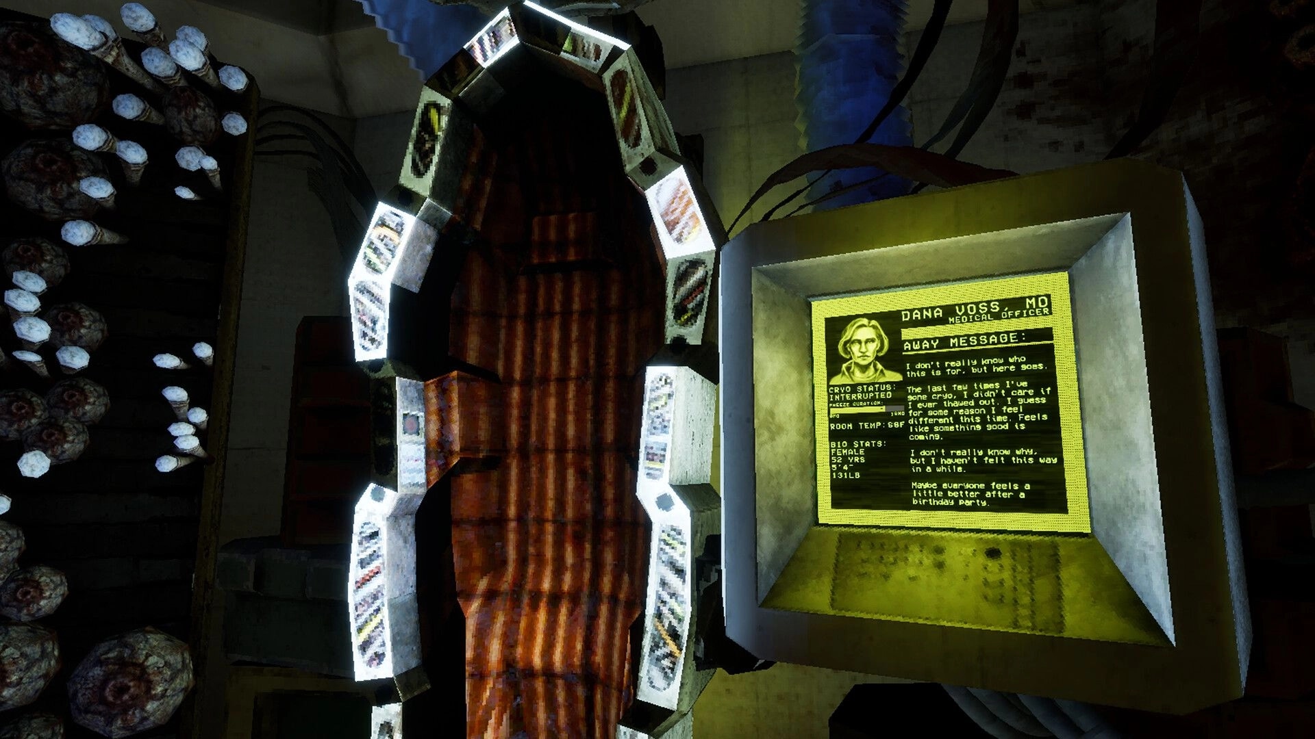 Ultrasound: Cryo chamber with medical monitor displaying Dana Voss's bio stats in dimly lit room.