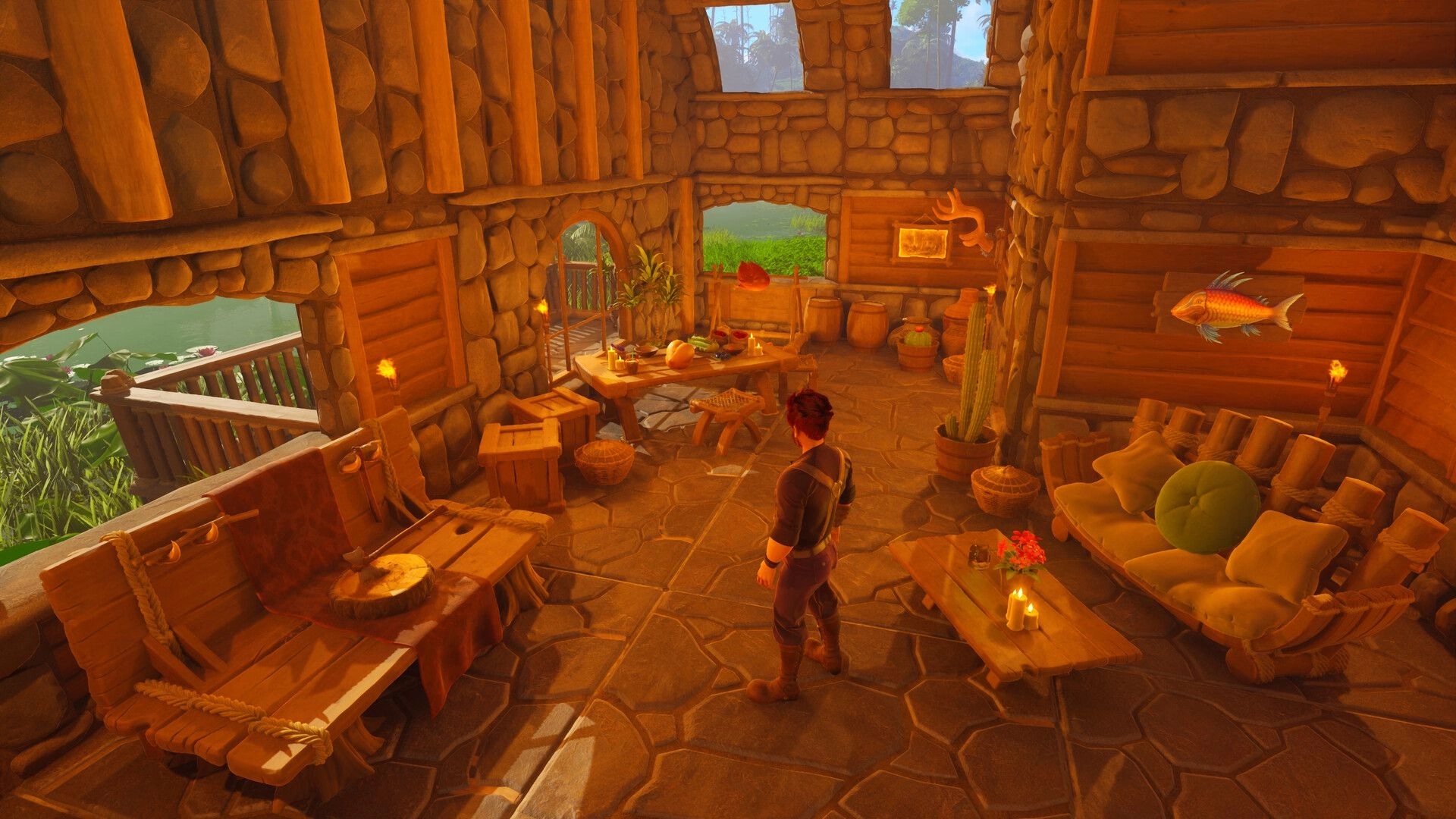 Under a Rock: Player stands in cozy stone-and-wood cabin with table, couch, candles, wall fish.