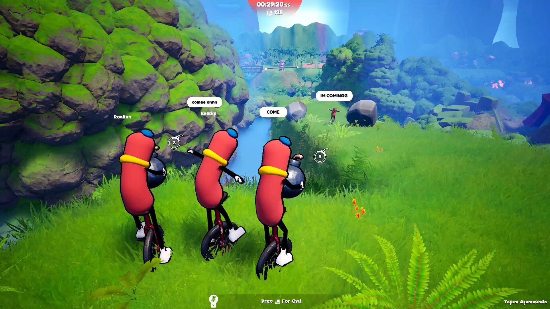 Unicycle Together: Three sausage riders with bombs chat on grassy cliff path above a river valley.