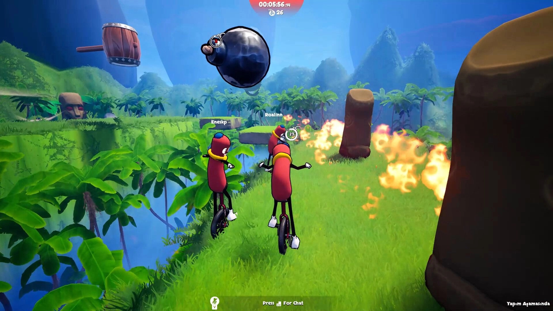 Unicycle Together: Two sausage riders dodge flames and a swinging bomb on a jungle cliff path.