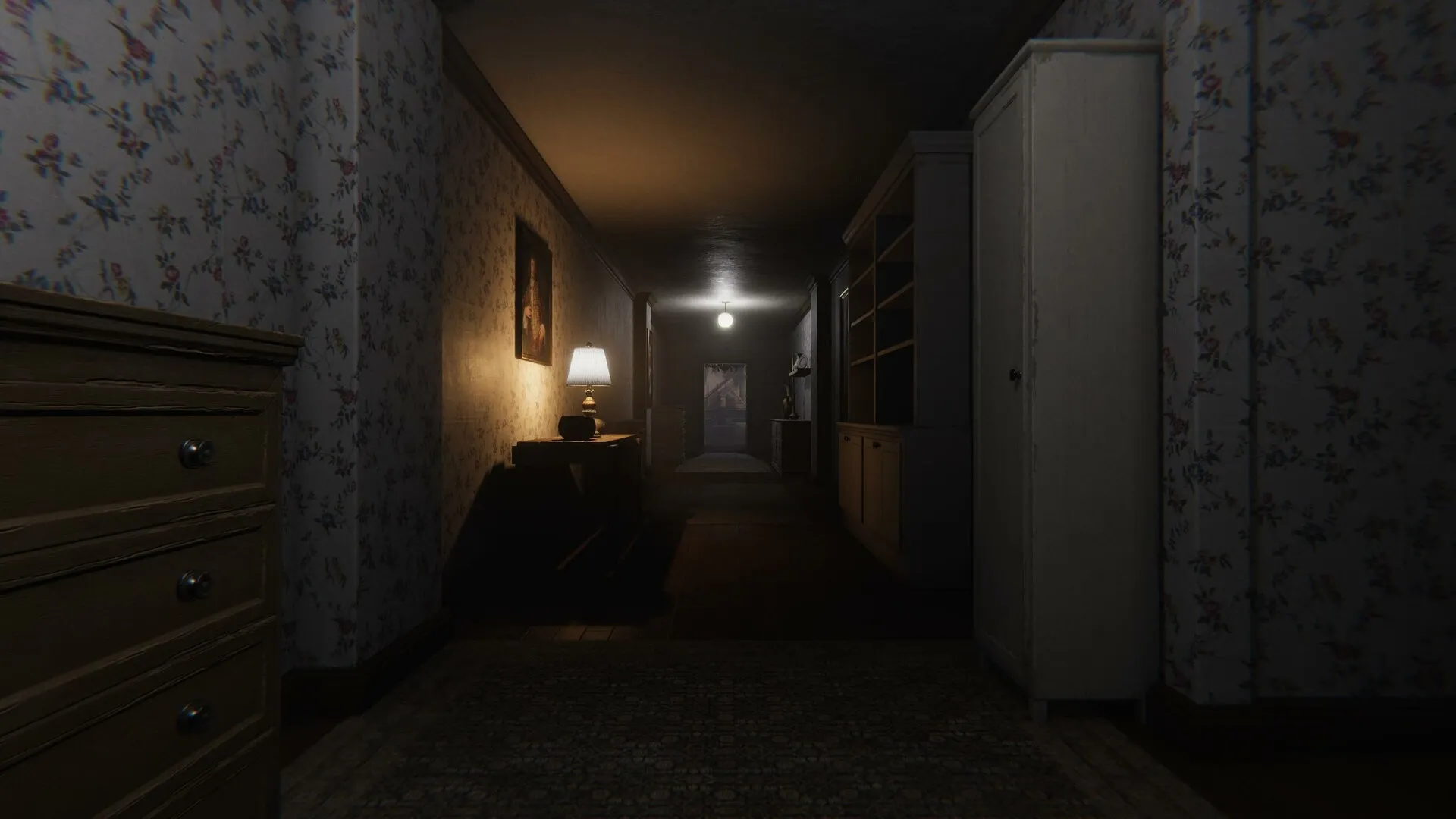 Unmourned: Dimly lit hallway with floral wallpaper, a glowing lamp, and distant door in eerie house.