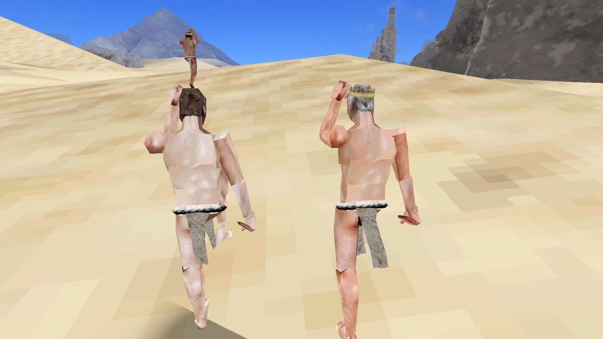Upstairs: Two players awkwardly walking up a sandy hill in a desert environment under a clear blue sky