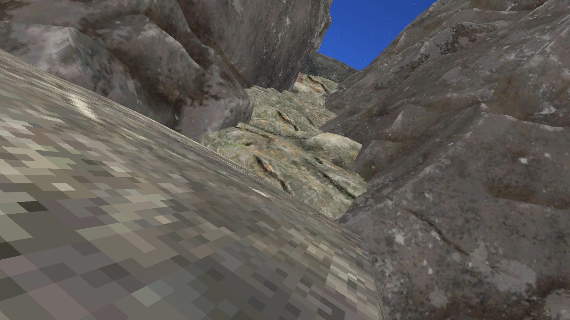 Upstairs: First-person view of rocky mountain path with steep cliffs under a clear blue sky