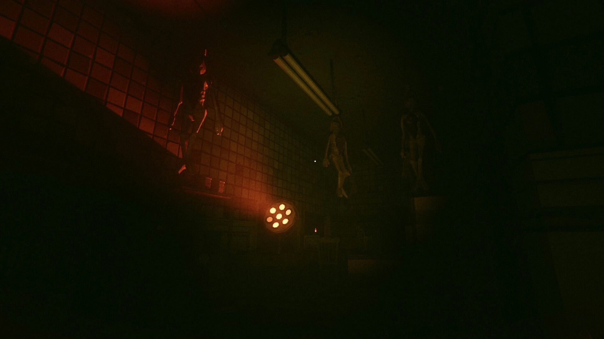 Urbex: Flashlight view of hanging bodies in a tiled room under flickering fluorescent lights.
