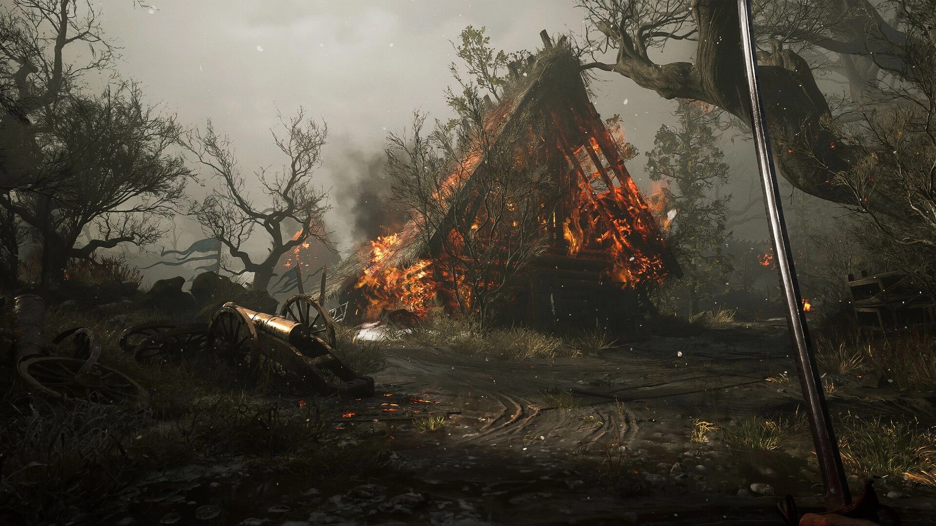 Valor Mortis: Sword in hand, player approaches burning village in desolate, war-torn landscape.