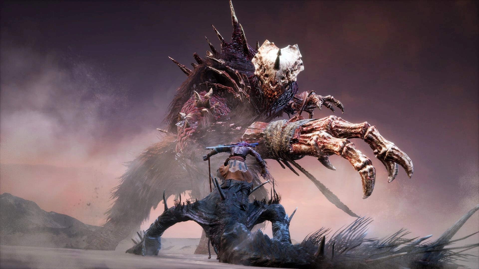 VANRAN: Player character faces a towering skull-faced beast in a foggy wasteland boss fight scene.