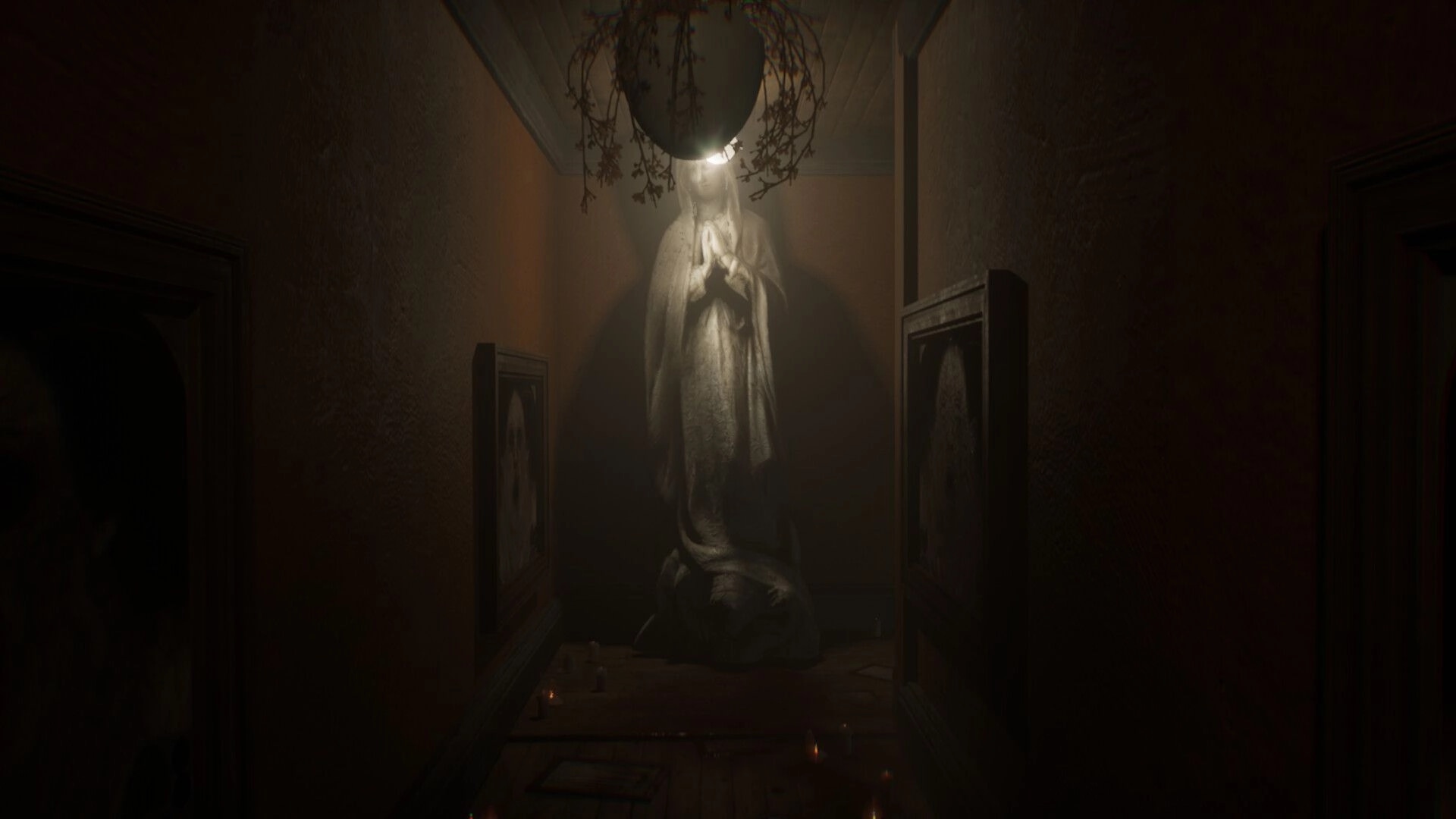 Vellar: Ghostly white statue illuminated by ceiling lamp in narrow hallway with framed portraits and candles.