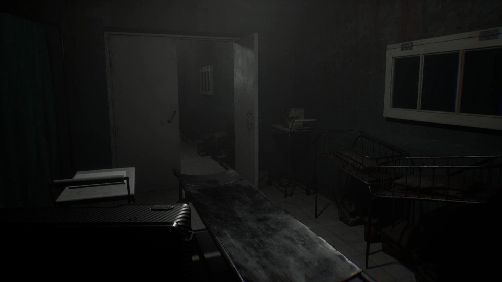 Vellar: First-person view of a grimy hospital room with gurney and empty crib in dim foggy light.