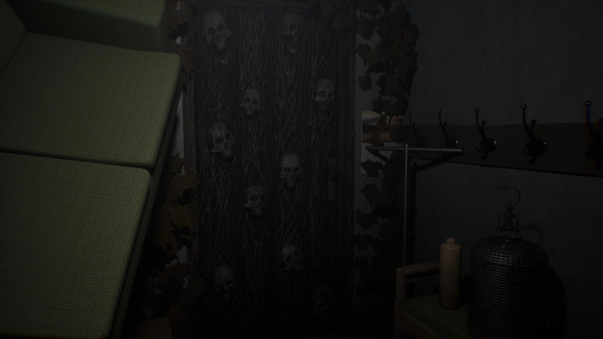 Vellar: First-person view of a hallway with skull-patterned wallpaper, coat hooks, candle and birdcage.