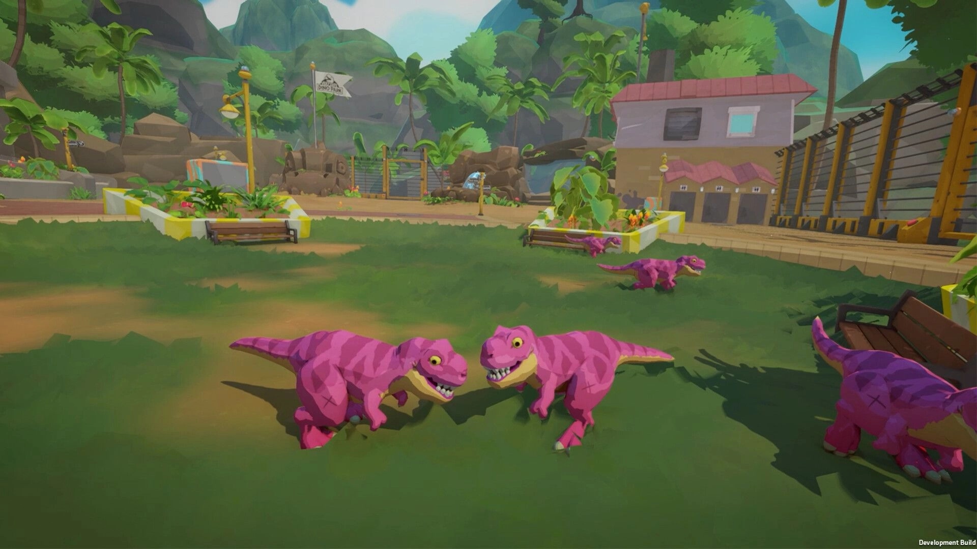 Very Safe Dino Park 🦖: Pink baby T-rexes roam grassy pen near benches, gate and park buildings.